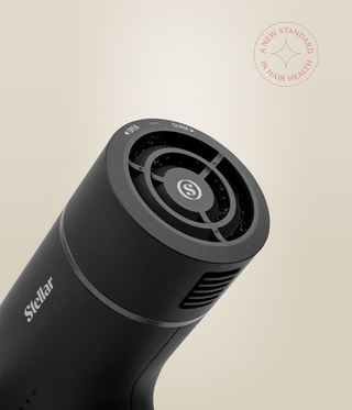 Close-up of the OmniFlex Dryer's circular rear filter cap with open and close markings.