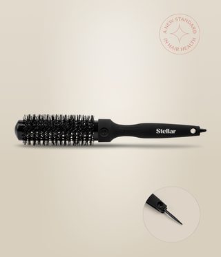 Side view of a slim black HeatSense Round Brush, with an inset showing the extended sectioning pin.