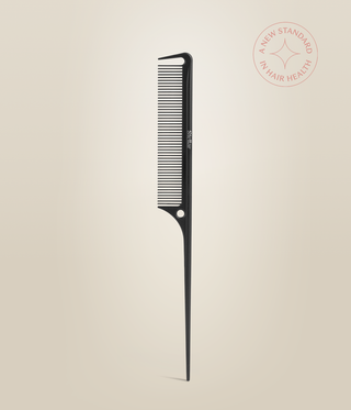 Black Carbon Tail Comb standing upright, with fine teeth above its pointed tail.